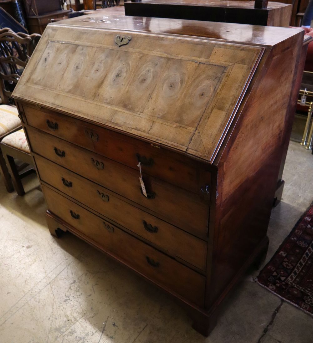 A Georgian style walnut and cross-banded bureau, width 107cm depth 54cm height 110cm